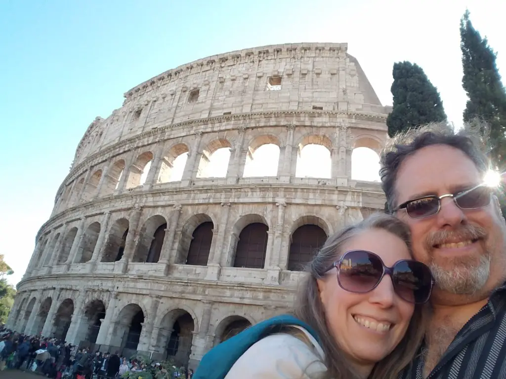 couple in front of colosseum in Rome