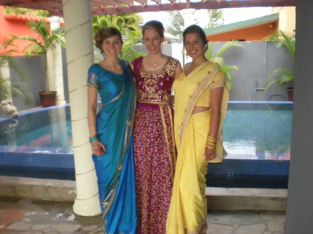 3 ladies dressed in Indian attire for a hindu wedding