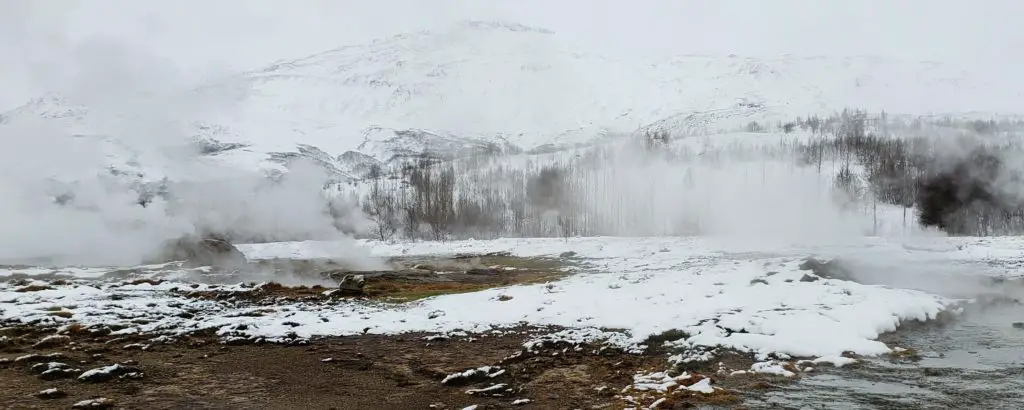 geothermal area with steam coming from the ground in Iceland