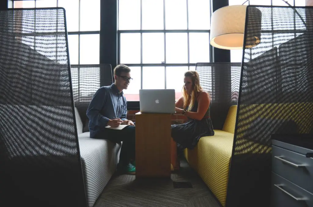 couple Gathering in front of computer to watch a talk