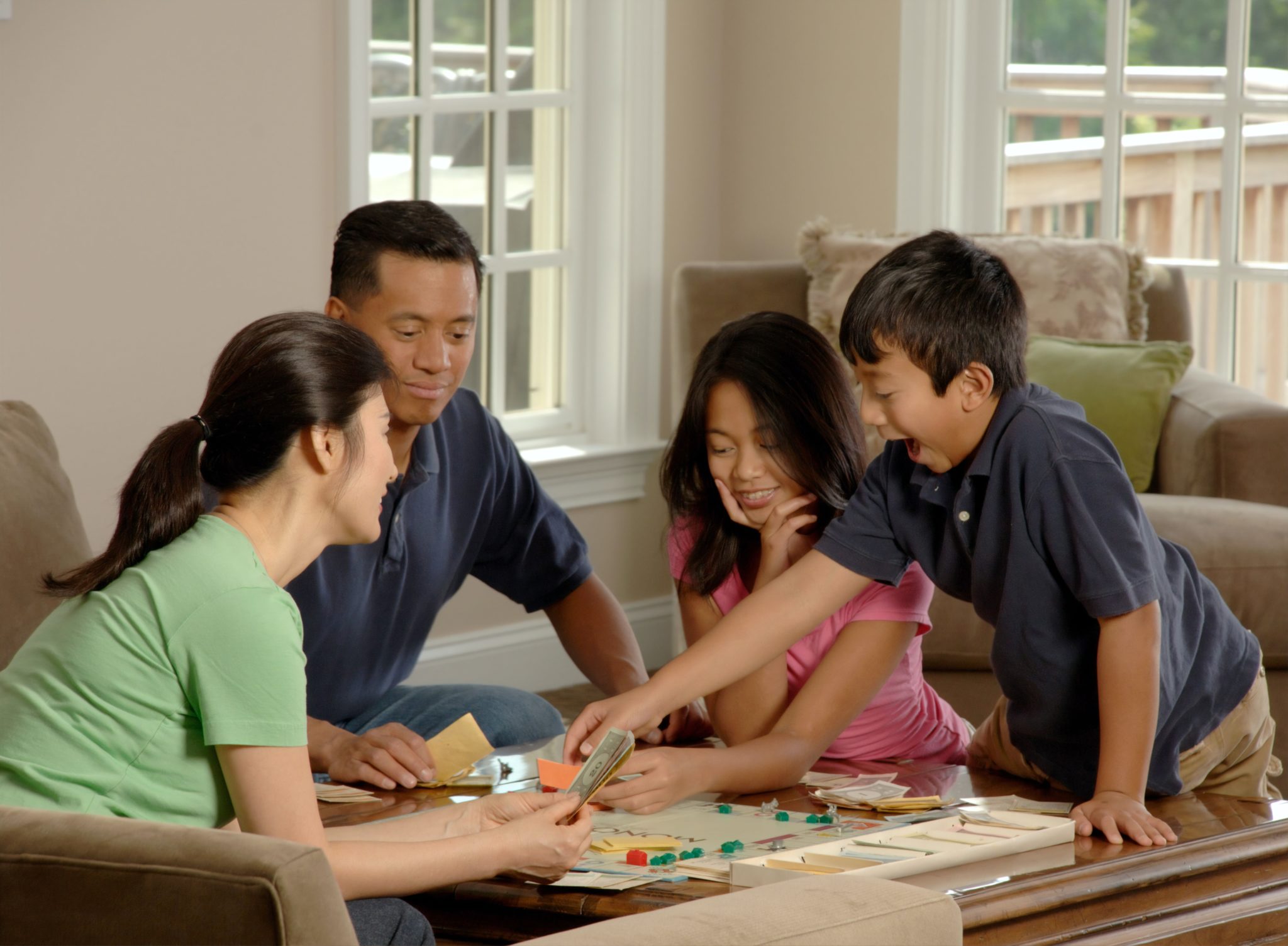 family playing a travel board game