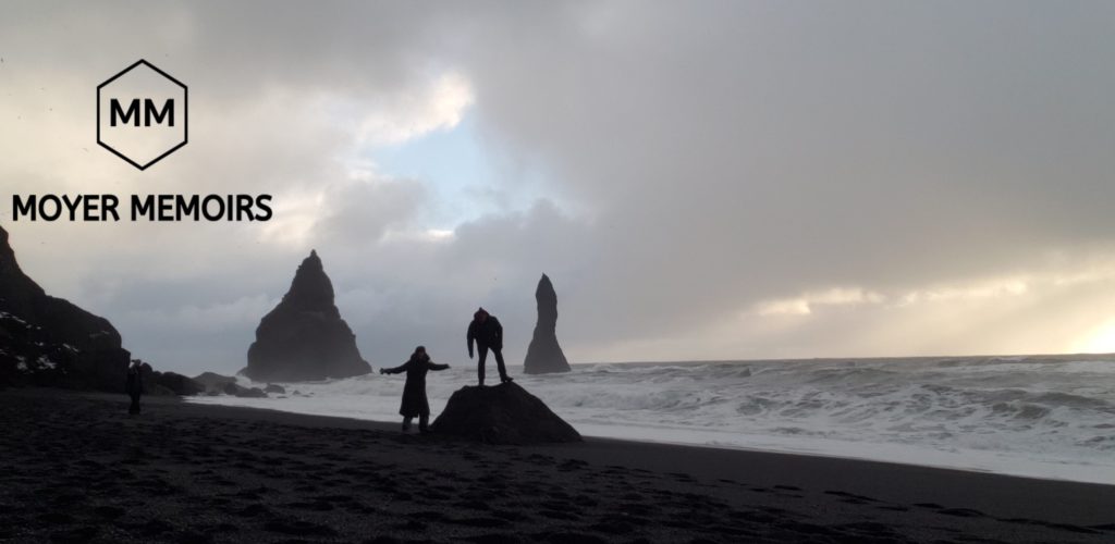 silouettes in front of Reynisfjara Sea Stacks