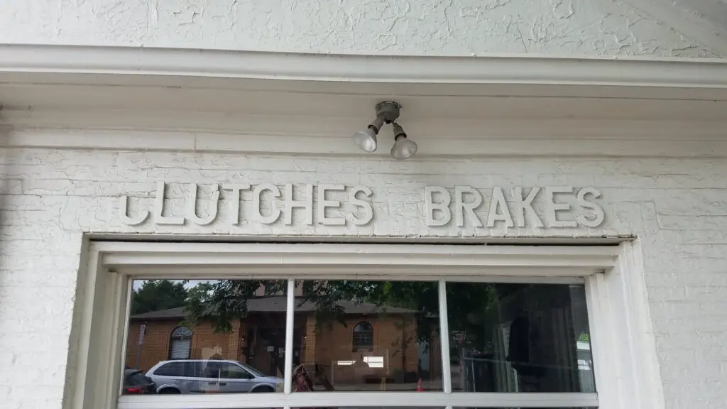 antique gas station sign for brakes at a shop on 12 South