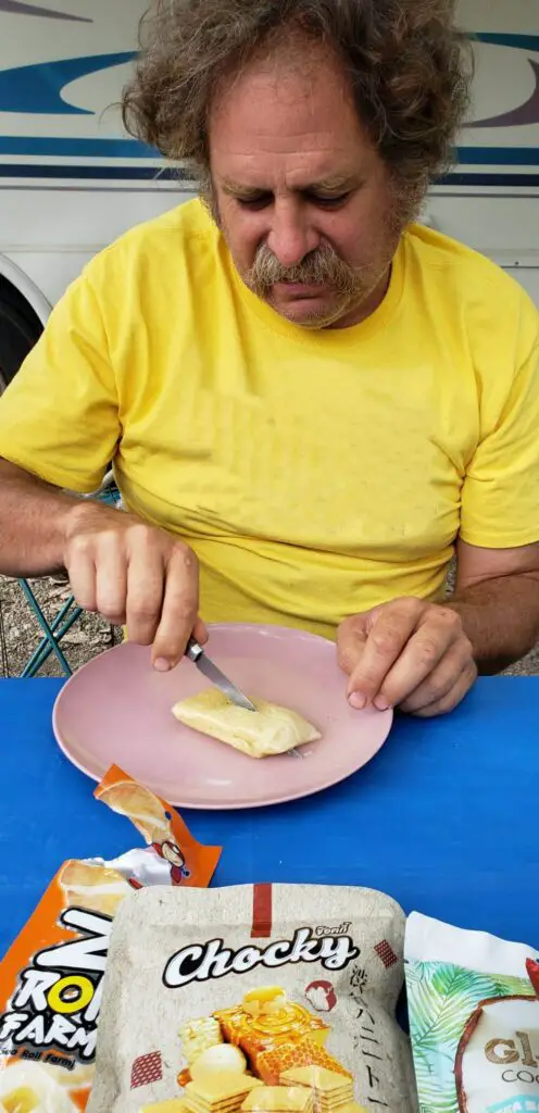 Cutting the Sticky Rice Treat from Universal Yums