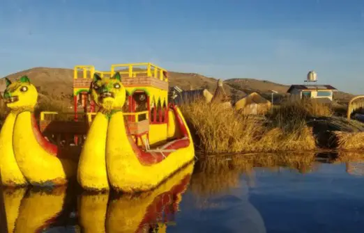 large reed boats in the water at uros floating islands