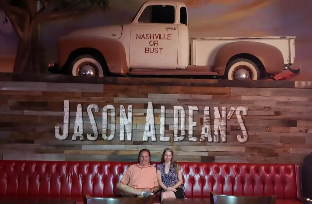 seated on a couch at Jason Aldeens bar and Restaurant on Honky Tonk Highway in NAshville