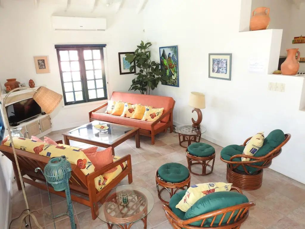 chairs and couches at Mock turtle bungalow - sitting room- Tobago guesthouses