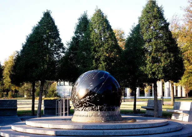 large globe war memorial in front of trees at bicentennial park in Nashville Tennessee