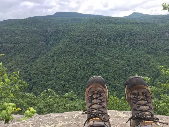 feet overlooking green mountain scenery at the catskills for an empty nest USA travel bucket list