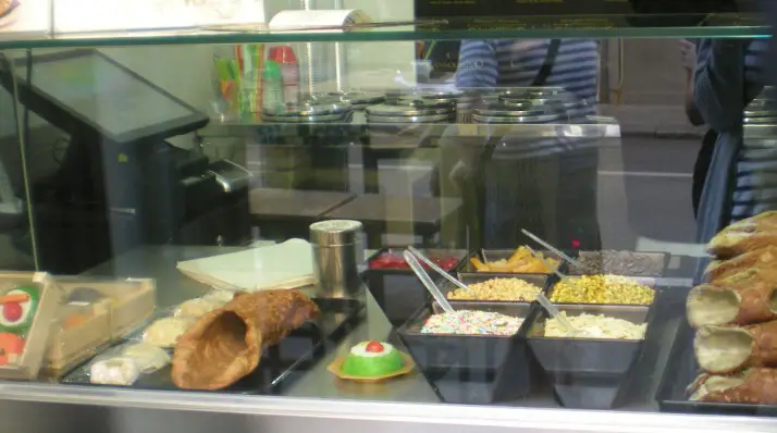 case full of desserts at a little shop in Palermo