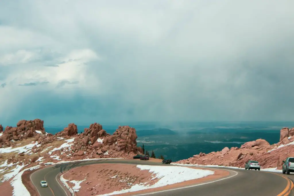 turns in the mountain road driving up Pikes Peak