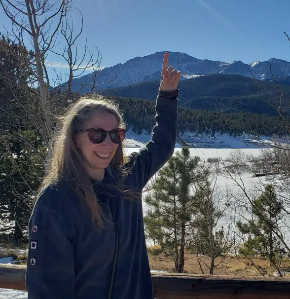 Pointing to the mountain that we drove to get to the summit of Pikes Peak