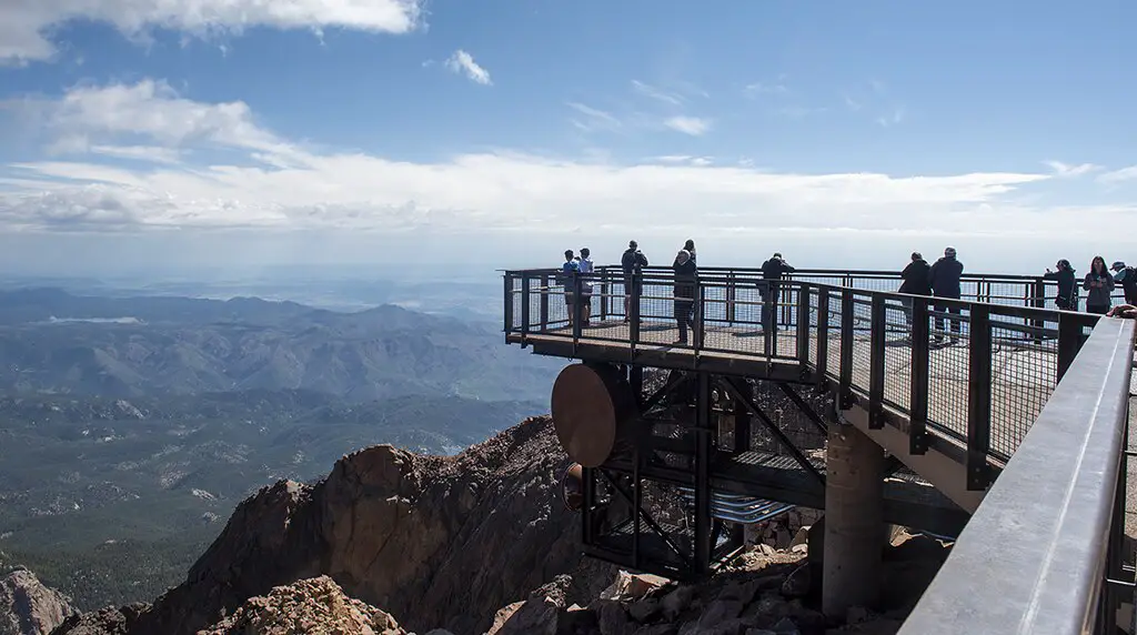 walkway overlooking mountains at the summit of pikes peak highway