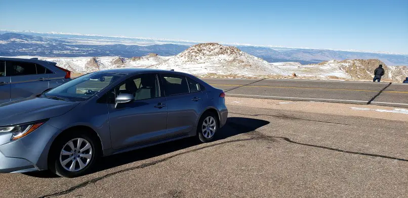 car parked in pull off area while driving up Pikes Peak in Colorado