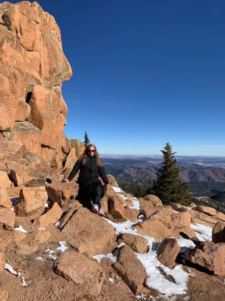 sitting on rocks at a Rocky Pullout near the summit of Pikes Peak