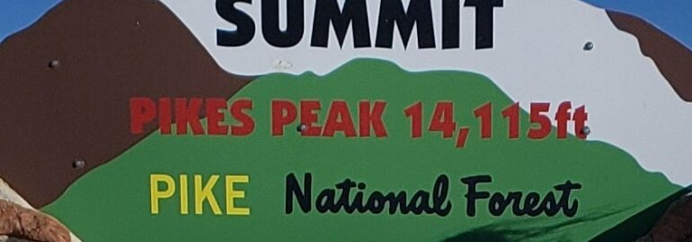 Sign at the summit after driving pikes peak