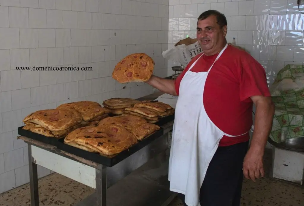 man at stove with Vendor of sfincione at Palermo Marketa