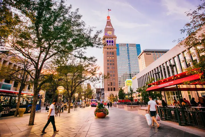 people walking around 16th street mall on a denver itinerary