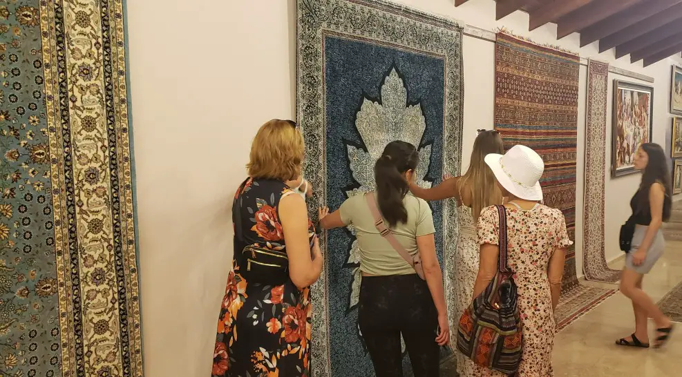 large turkish rugs hung on a wall in a rug warehouse in turkey