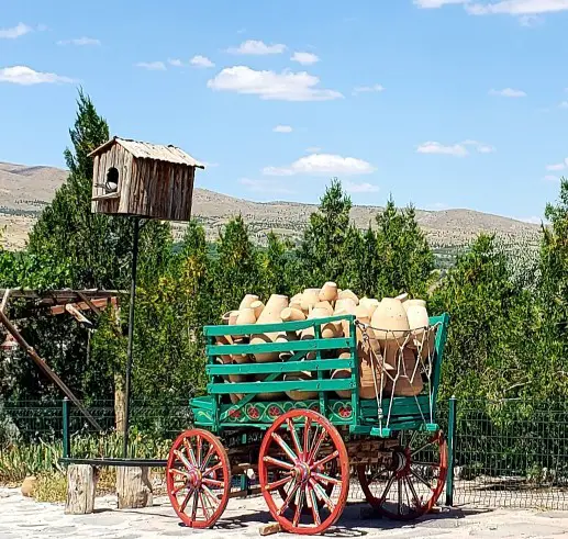 wagon full of red clay pottery at Chez Galip in Avanos Turkey