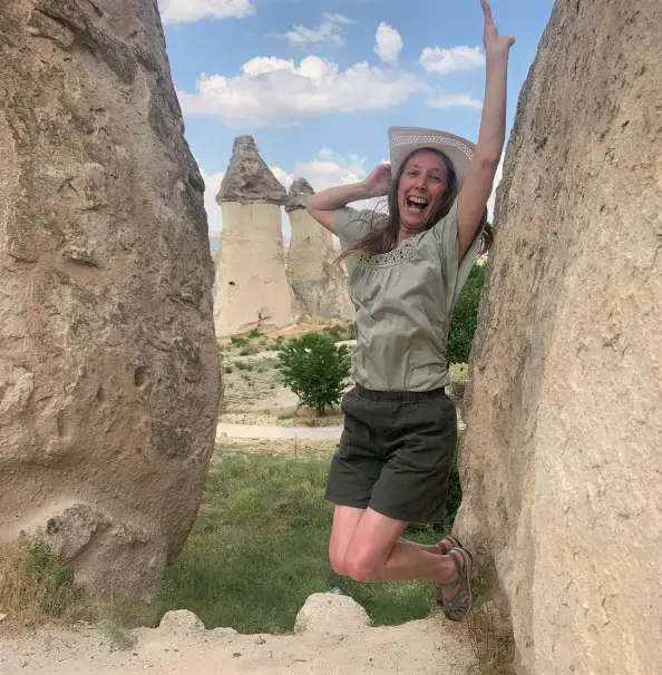 jumping in rocky landscape in cappadocia turkey during 2 day trip