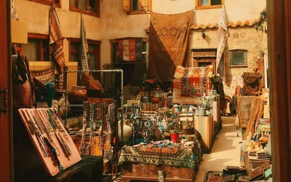 haggling over rugs displayed at a market for sale in turkey