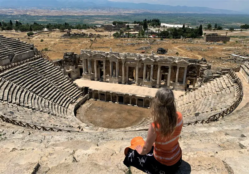 sitting on top of ancient theater seats at Hieroplois in Turkey