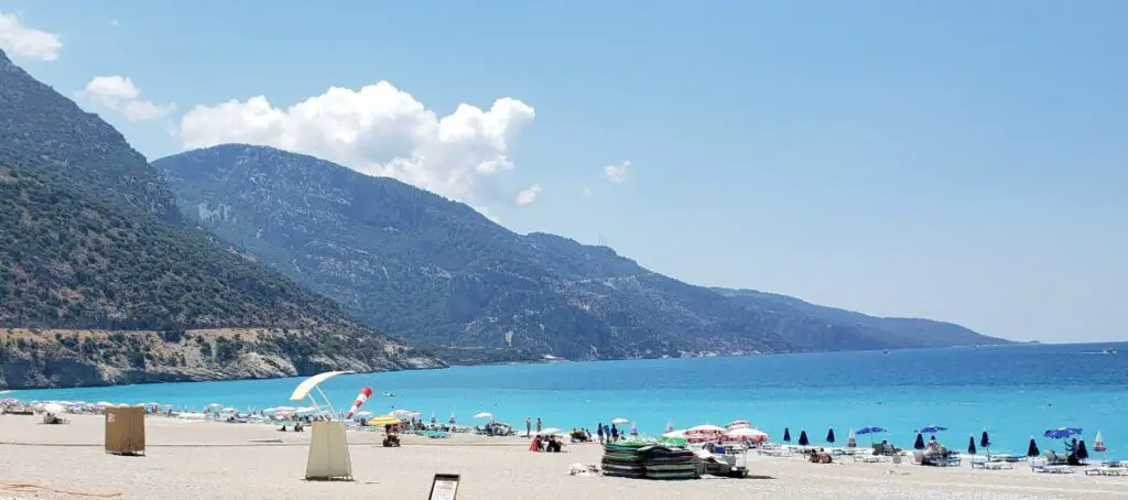 sand and blue water at Oludeniz Beach in Turkey