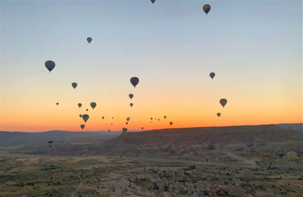 many hot air balloon in the sky during sunrise in cappadocia turkey