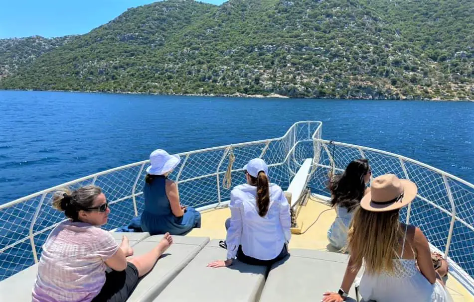 group tour sitting on the deck of a boat on a small group tour of Turkey