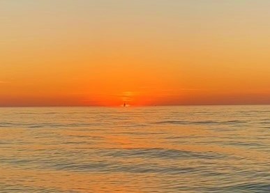 sunset on the beach at the best beach near cleveland ohio - mentor headlands