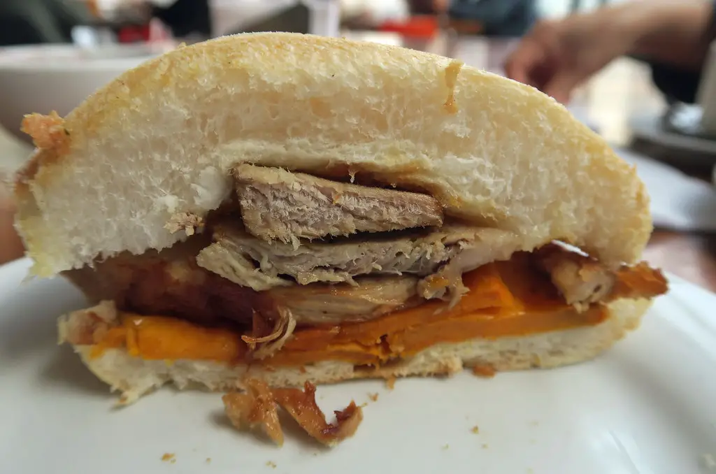 sandwich on table- Chicharron - authenic food of Peru