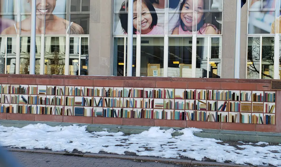 mural of books at Denver Library in Winter