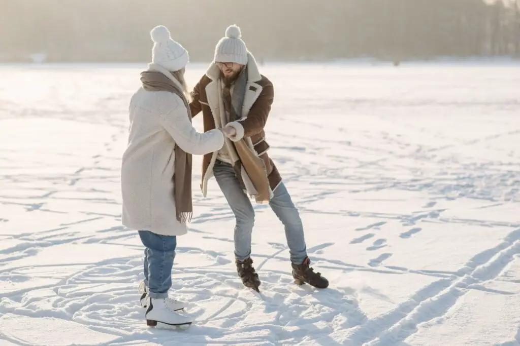 Ice skaters on a frozen pond enjoying winter in denver