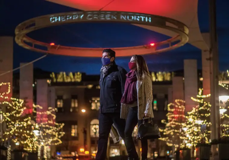 couple walking in shopping mall at christmas in Denver at Cherry Creek Mall