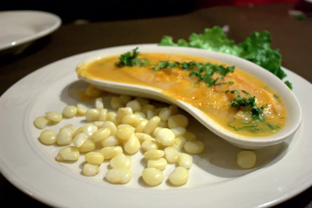 dish of corn and Tiradito - traditional foods of Peru