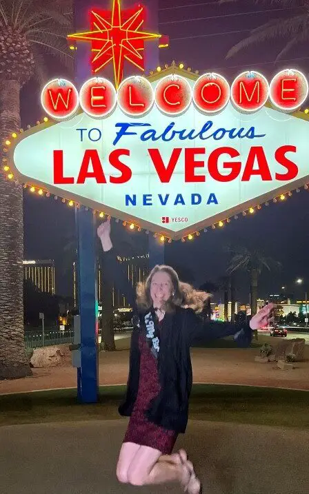 jumping to celebrate my 50th birthday vacation in Las Vegas at the sign