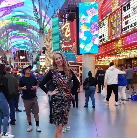 Posing on the busy Fremont Street in Las Vegas during 50th birthday party