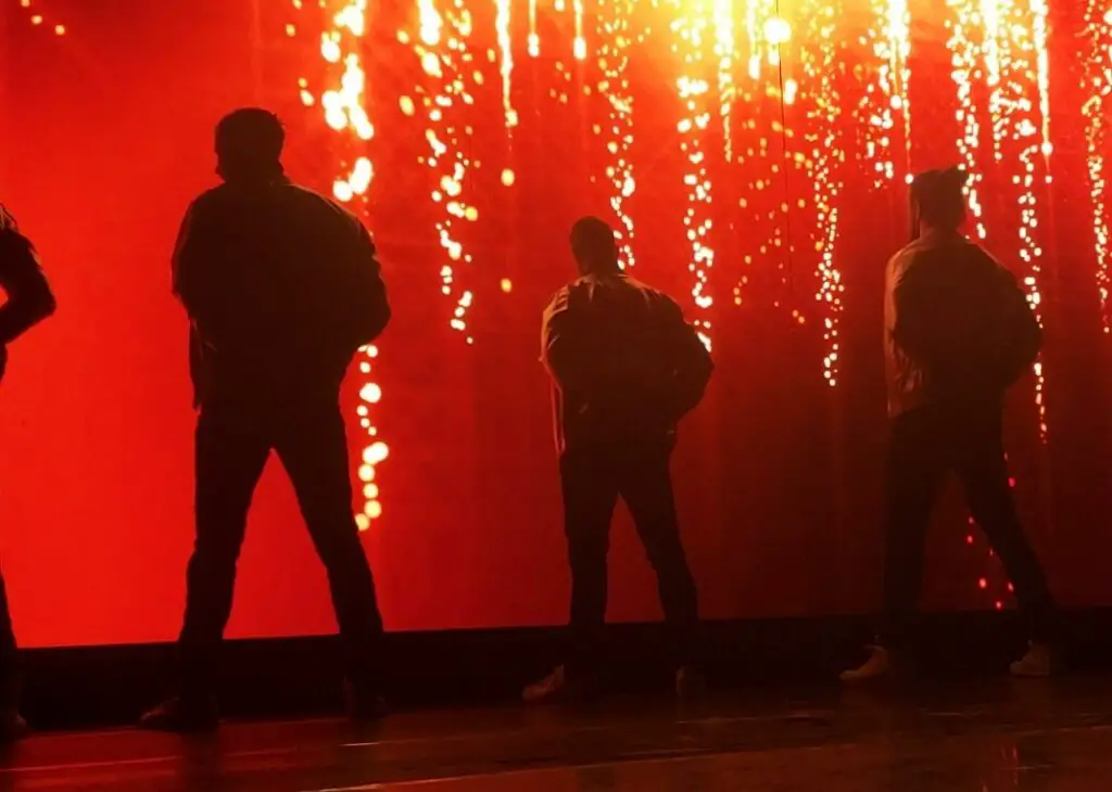 men in front of red screen during Thunder from down under 2 for 50th birthday party in Las Vegas