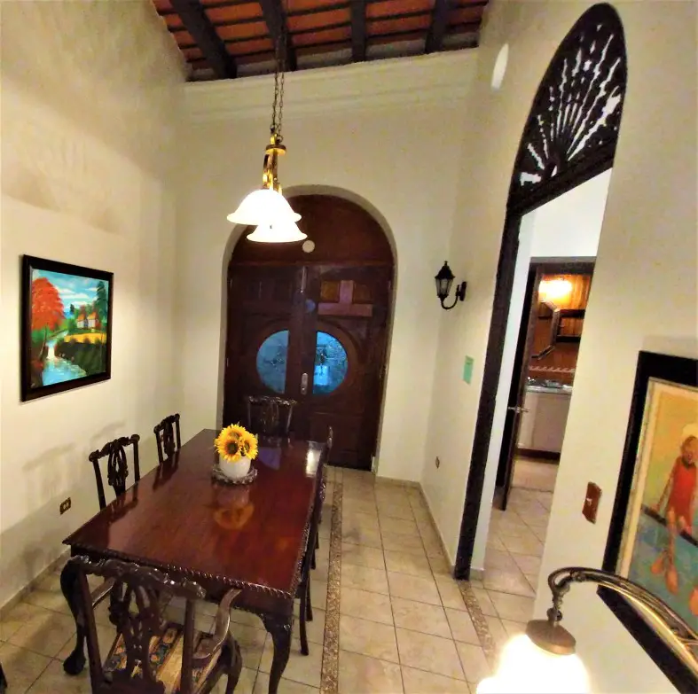 large dining room table in the middle of the room at Fortaleza Suites in old San Juan Puerto Rico