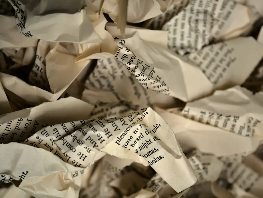 typewritten pieces of paper crinkled up