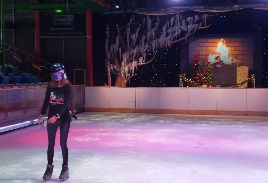 girl on ice skates in a skating rink on a cruise ship
