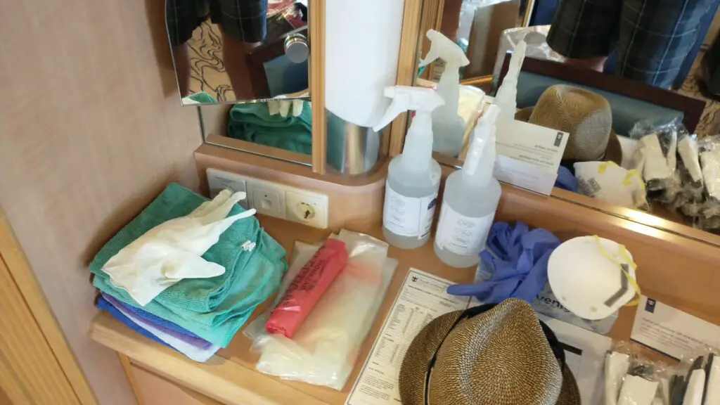 sanitizing supplies like gloves, masks, and spray on the covid ward of a cruise ship