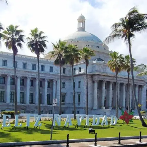 large white colonial building with pillars and palm trees out front - Capitol Building in Old San Juan Puerto Rico - exploring one day in San Juan Puerto Rico