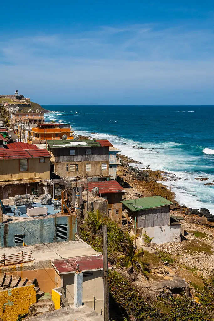 colorful shacks overlookingt the water in La Perla Shantytown on a one day tour in San Juan Puerto Rico