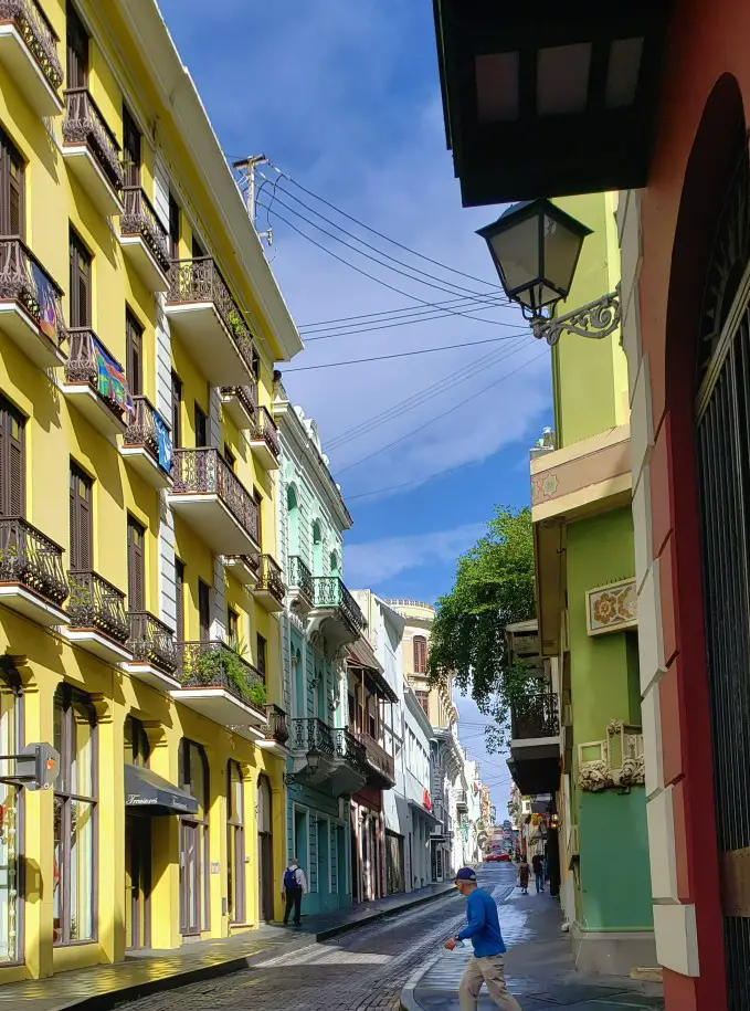 yellow and blue historic buildings in the streets of old san juan puerto rico