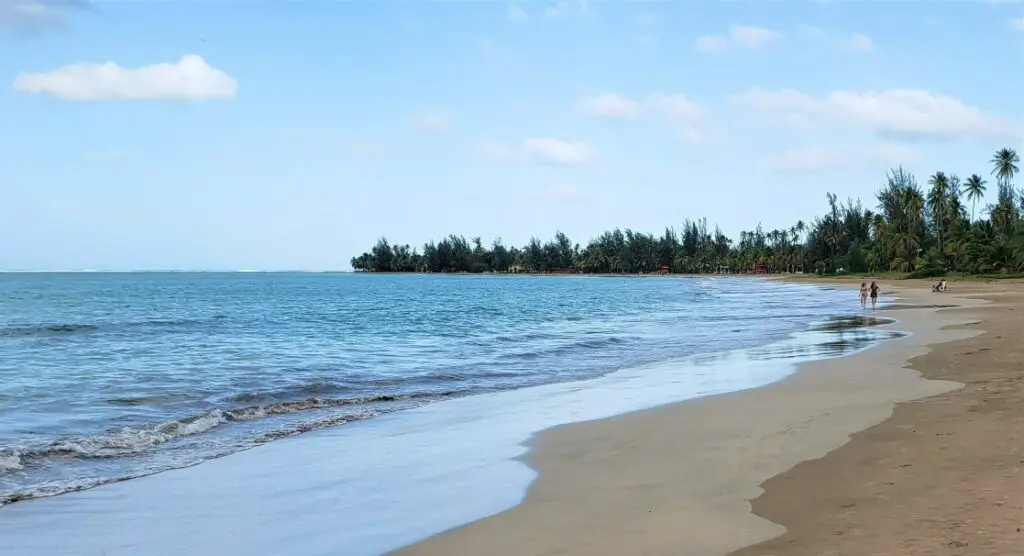 water coming on shore of a beach while tourists are visiting the Beach in Lulquillo during 3 days in Puerto Rico