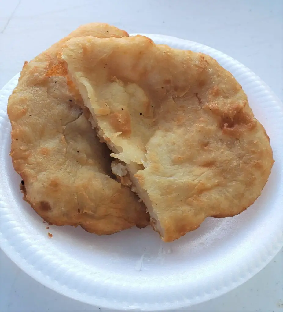 deep fried food cut in half on a plate An order of Arepas from the Pinones Food Kiosk in Puerto Rico