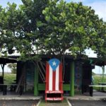 Wooden Puerto Rico Chair in front on the Pinones Food kiosk in Puerto Rico