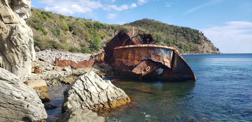 rusty ship at the end of the hike in st kitts from majors bay